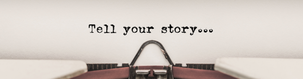 Typerwriter with word 'tell your story' in print